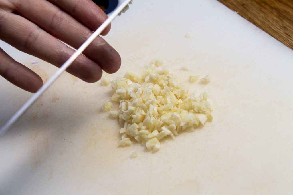 a small mound of chopped garlic