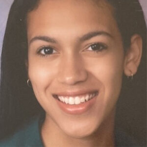 A headshot of Tyler Conzone, a Black woman who is smiling