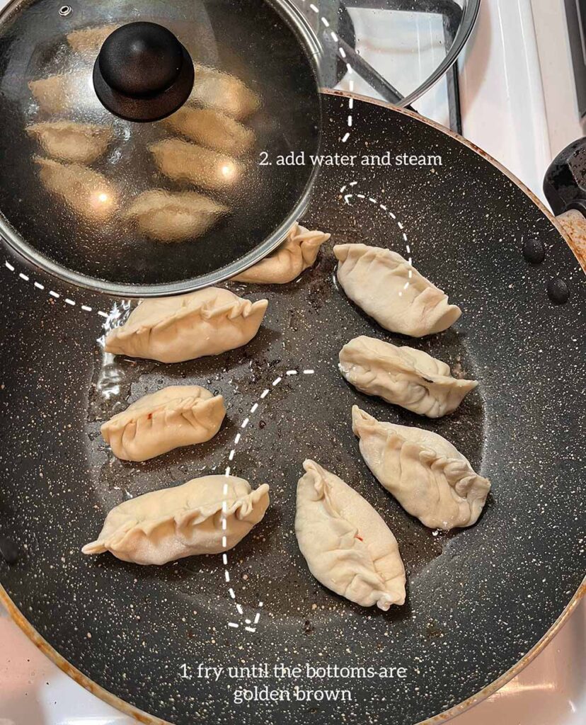 Eight dumplings sit in a frying pan. A caption says, "1. fry until the bottoms are golden brown. An inset image of the same dumplings in the same pan but with a lid on the pan says "2 add water and steam"